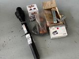 a picture of the contents of a flashlight and a box of cigarettes