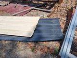 a pile of wood that is laying on the ground