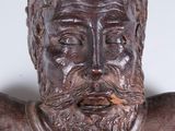 a statue of a man with a beard and a hat on