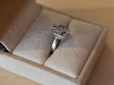 a ring that is sitting in a box on a table