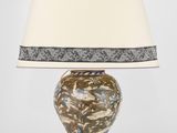 une image représentant une lampe de table munie d'un abat-jour