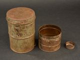an old tin can and a small tin can on a table