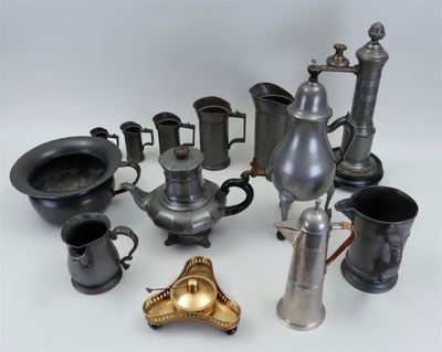 many different types of coffee pots and cups on the table
