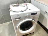 a washer and dryer in a small room