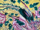 a painting of a bird and flowers on a yellow background