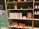 a shelf with many different types of spices and jars on it