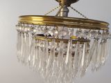 a close up of a chandelier hanging from a ceiling