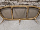 an image of a couch made out of bamboo sticks on a concrete floor