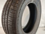 a close up of a tire on a white surface