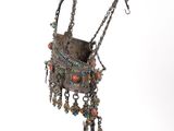 an image of a silver purse with a chain hanging from it ' s side