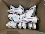 a cardboard box full of baby bottles and a bottle of toothpaste