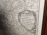 a picture of an old map on the wall