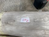 a roll of plastic wrapped up on the ground