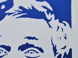 a blue and white drawing of a man with a mustache