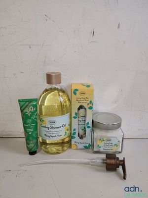 a bottle of liquid and a tube of toothpaste next to a tube of toothpaste and a tube of toothpaste