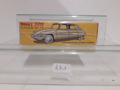 a glass display case with a toy car on it