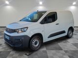 the white van is parked on a checkered floor in a garage