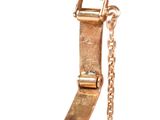 a close up of a gold watch on a chain