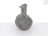 a small vase that is sitting on a table