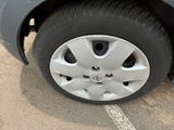 a close up of a car ' s tire on the street