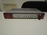a close up of a red and silver device on a white table