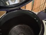 a close up of an open air fryer on a counter