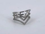 a close up of a silver ring on a white surface