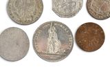 six different british coins including one penny, one penny, one penny, and one penny