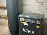 an image of a tank and a water heater in a garage