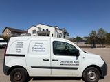 a white van that is parked in a parking lot
