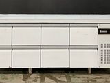 a white refrigerator that is sitting on top of a table