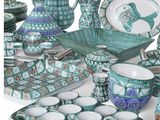 many different types of dishes and cups on the table