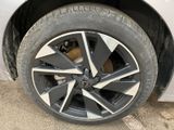 a close up of a tire on a white car