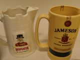 two mugs sitting next to each other on a counter