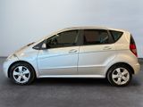 the silver car is parked in the garage with its door open
