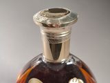 an image of a bottle of brandy sitting on a table