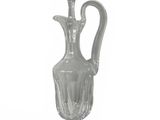 a clear glass vase with a flower on top of it