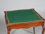 a small table with a green cloth on it
