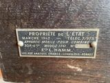 a close up of a plaque on the side of a wooden cabinet