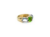 a close up of a gold ring with a green and blue stone