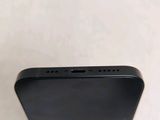 the back of a black iphone with a white background