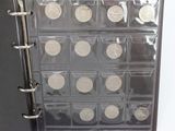 a picture of a binder with a lot of coins in it