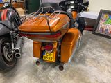 two motorcycles that are parked next to each other in a garage