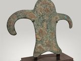 a close up of a metal object on a wooden stand