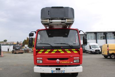 a red fire truck parked in a parking lot