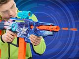 the man is playing with a nerfle gun on a blue background