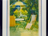 painting of a garden scene with a table and chairs and an umbrella
