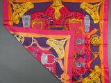 purple and pink silk scarf with a picture of a horse and other items