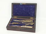a wooden box with a set of tools inside of it