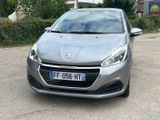 the front view of a silver car parked in a parking lot